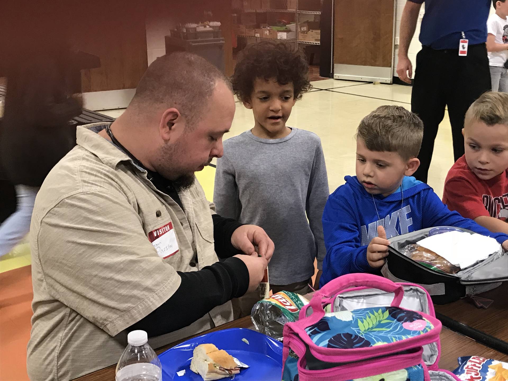 Veterans eating lunch with students