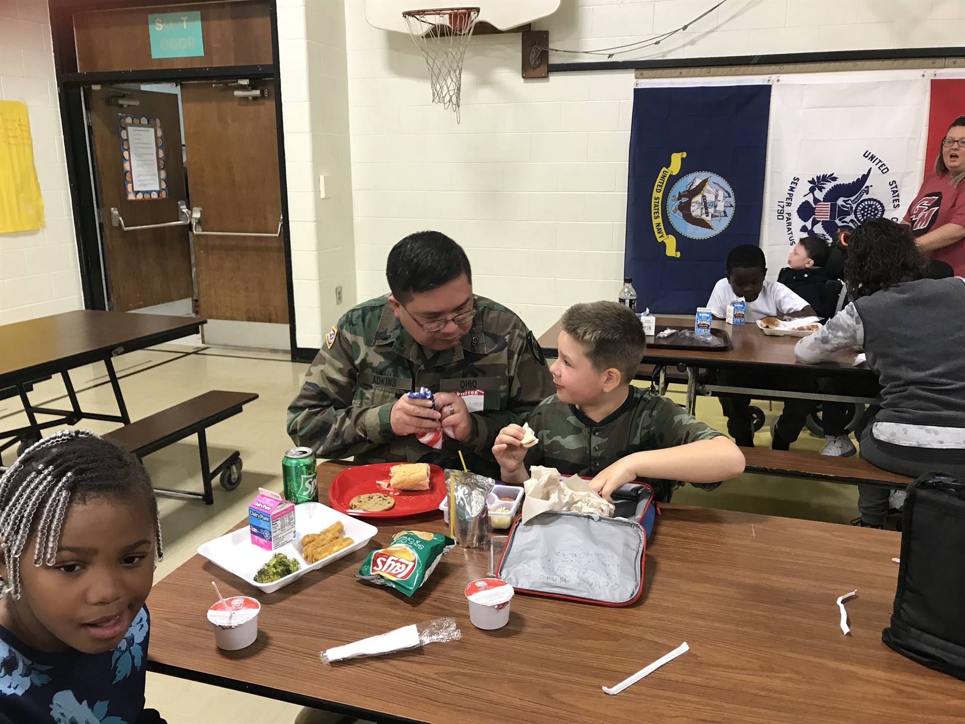 Veterans eating lunch with students