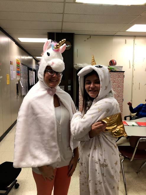 Mrs. Fisher and a student dressed as unicorns