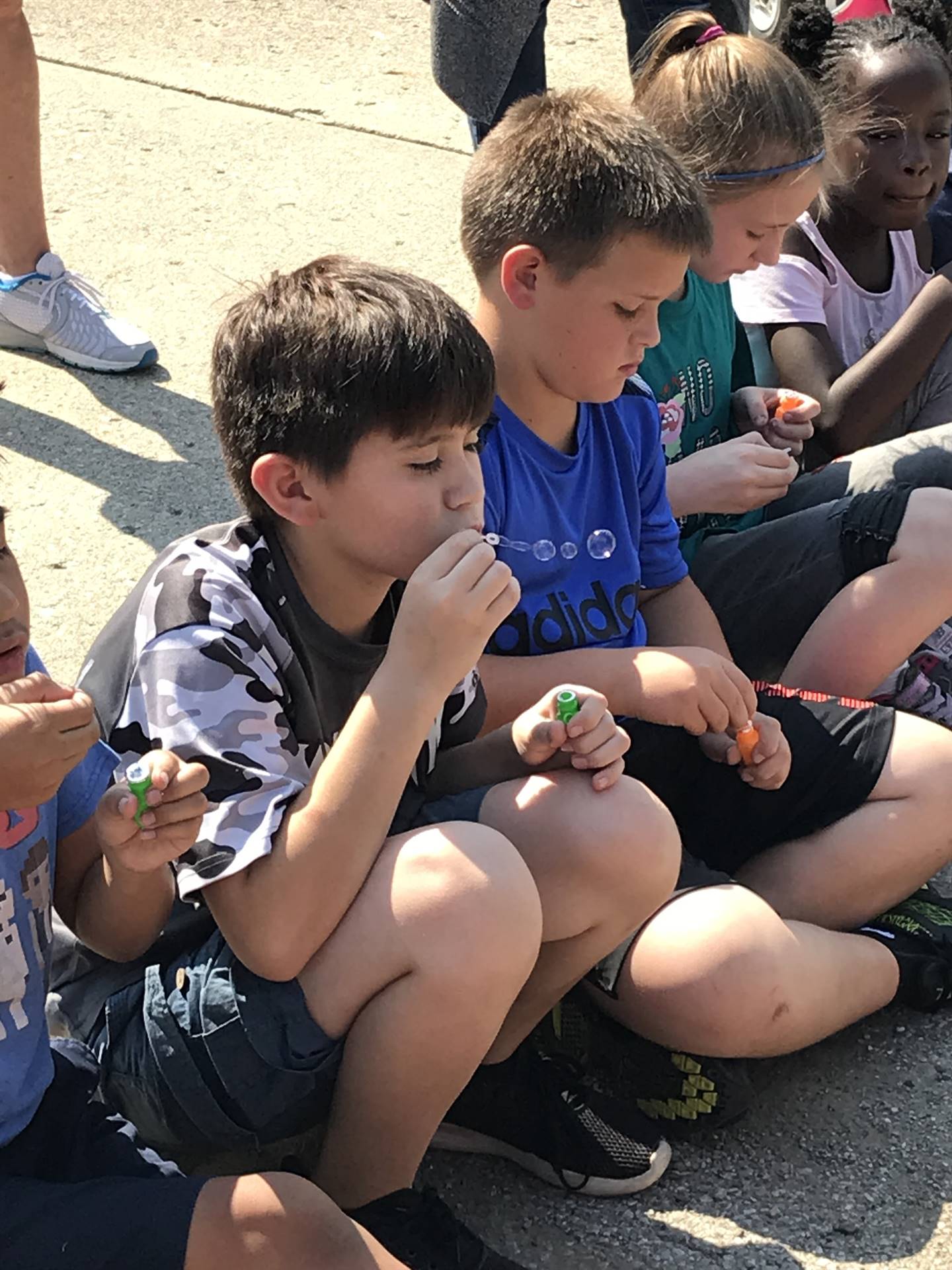 Children blowing bubbles