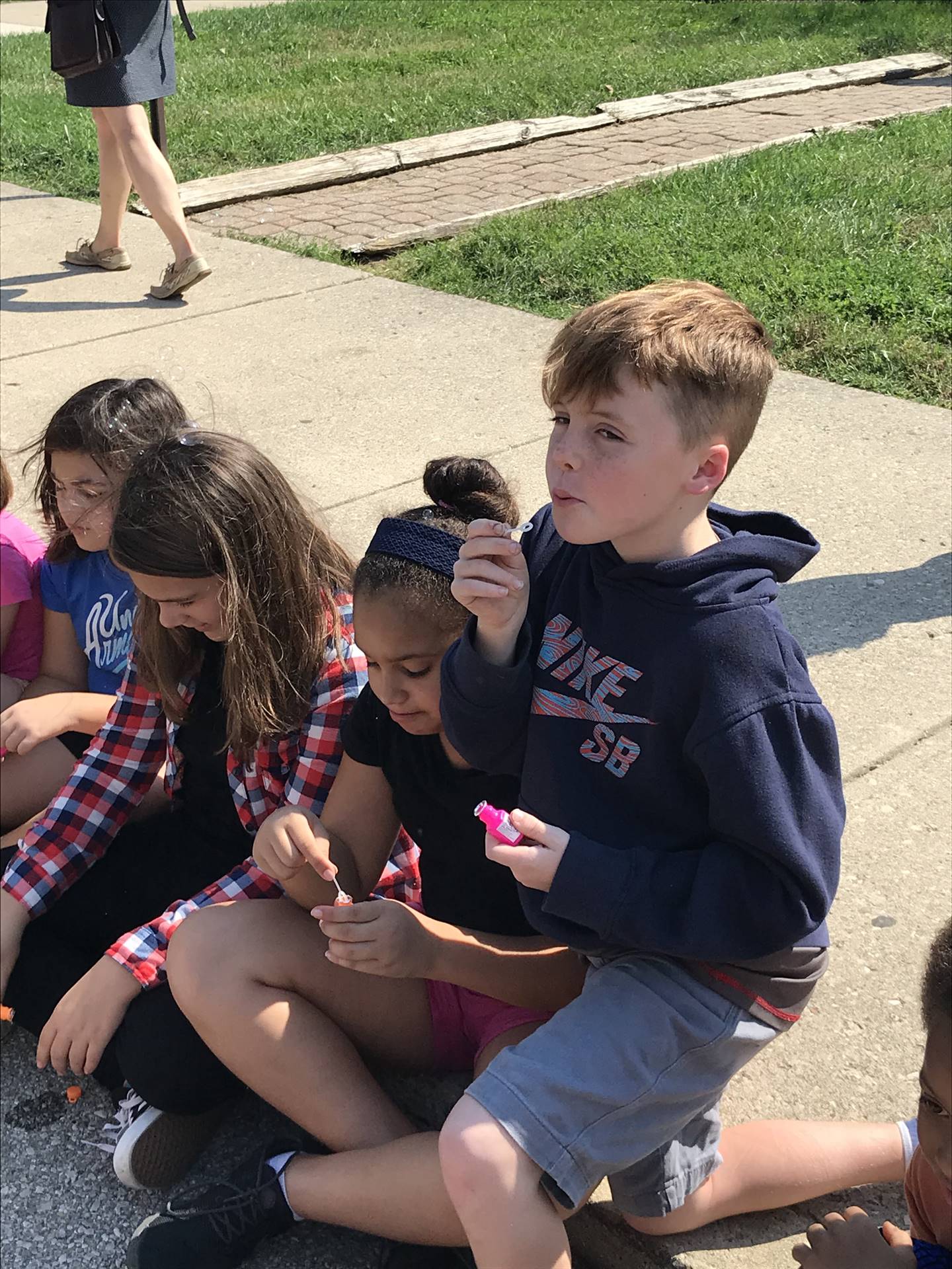 Children blowing bubbles