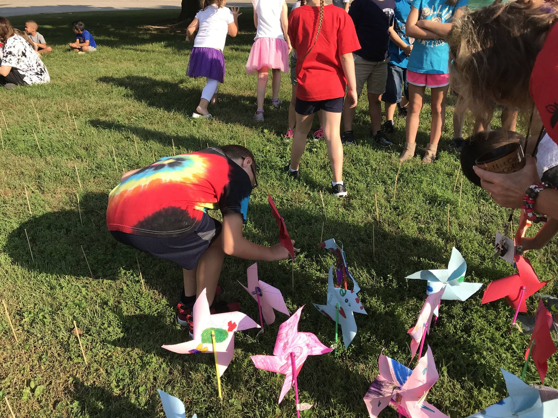 Boy placing pinwheel