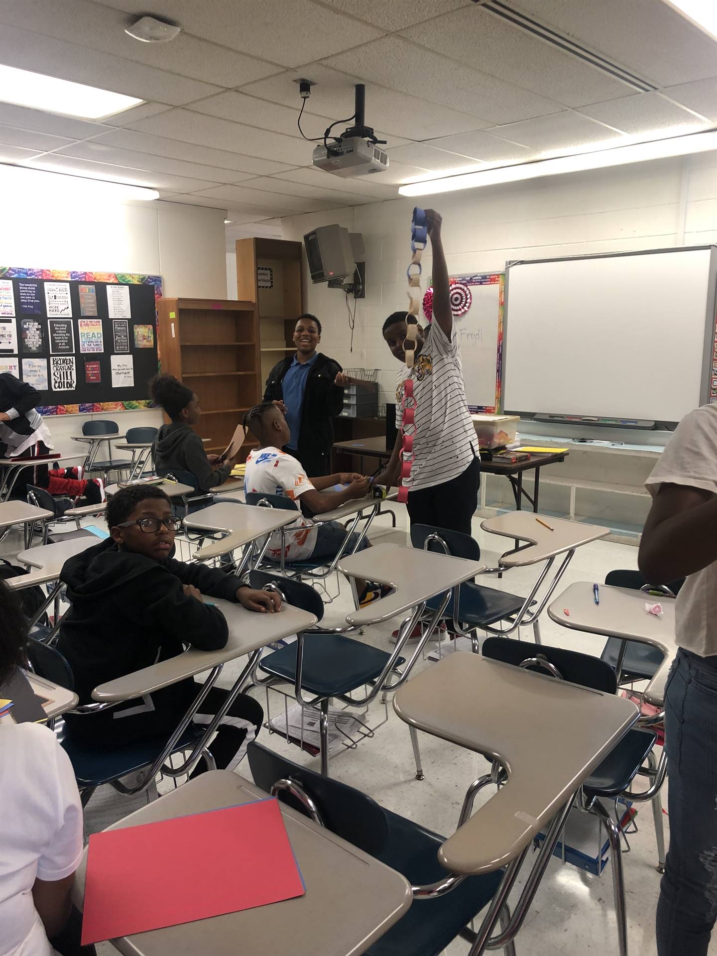 Students building paper chains