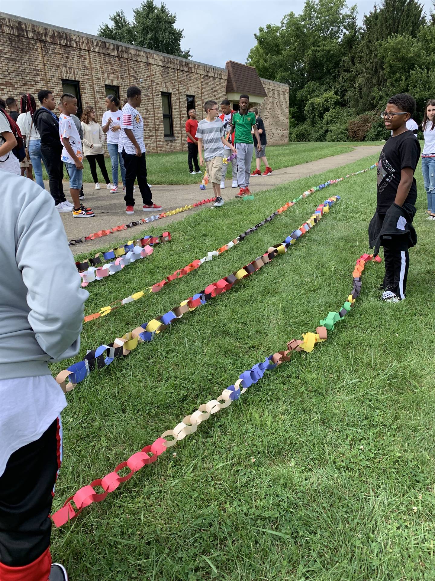 paper chains being measured outside