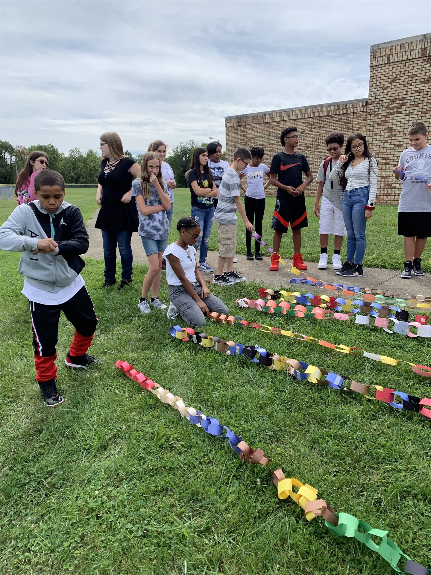 paper chains being measured outside