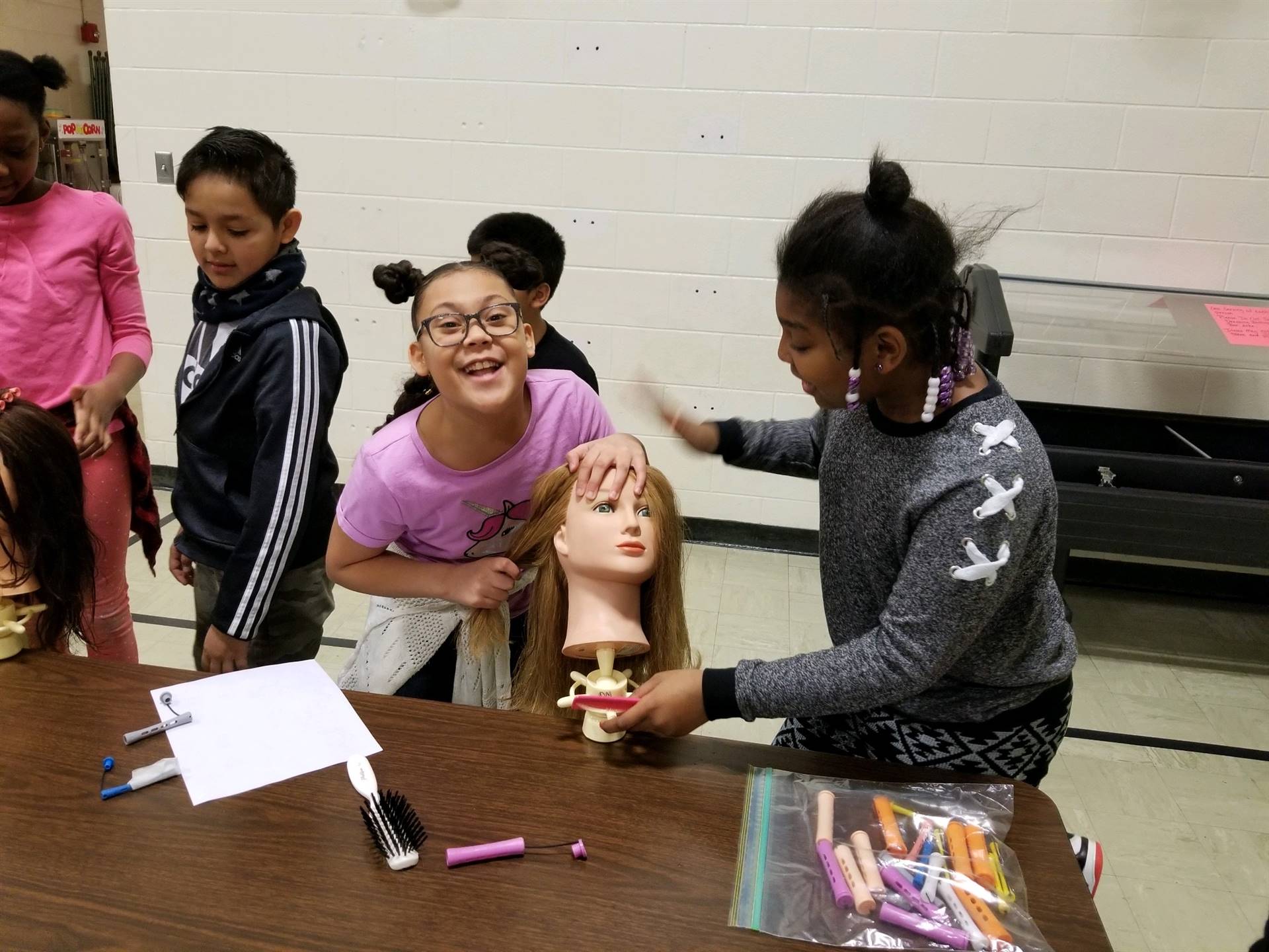 Students practicing hair styles