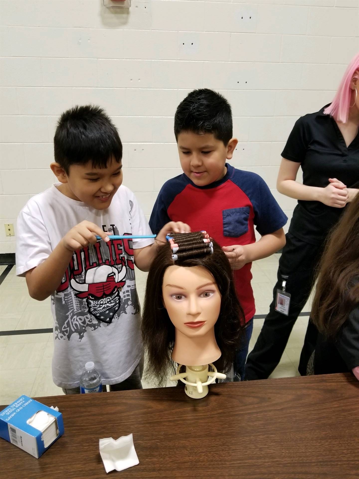 Students practicing hair styles