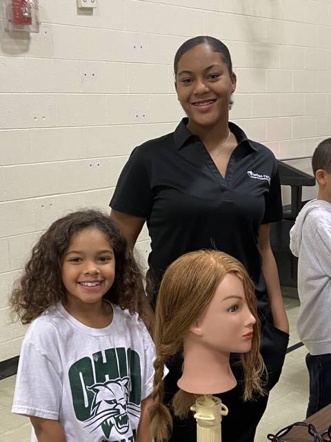 Students at the Hair station