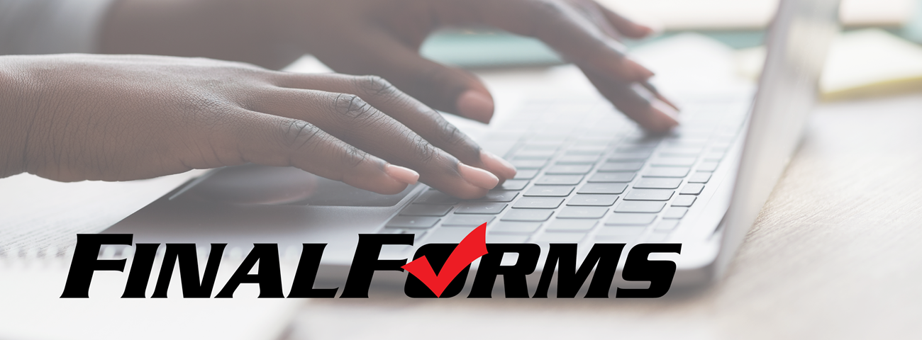 woman&#39;s hands typing on laptop