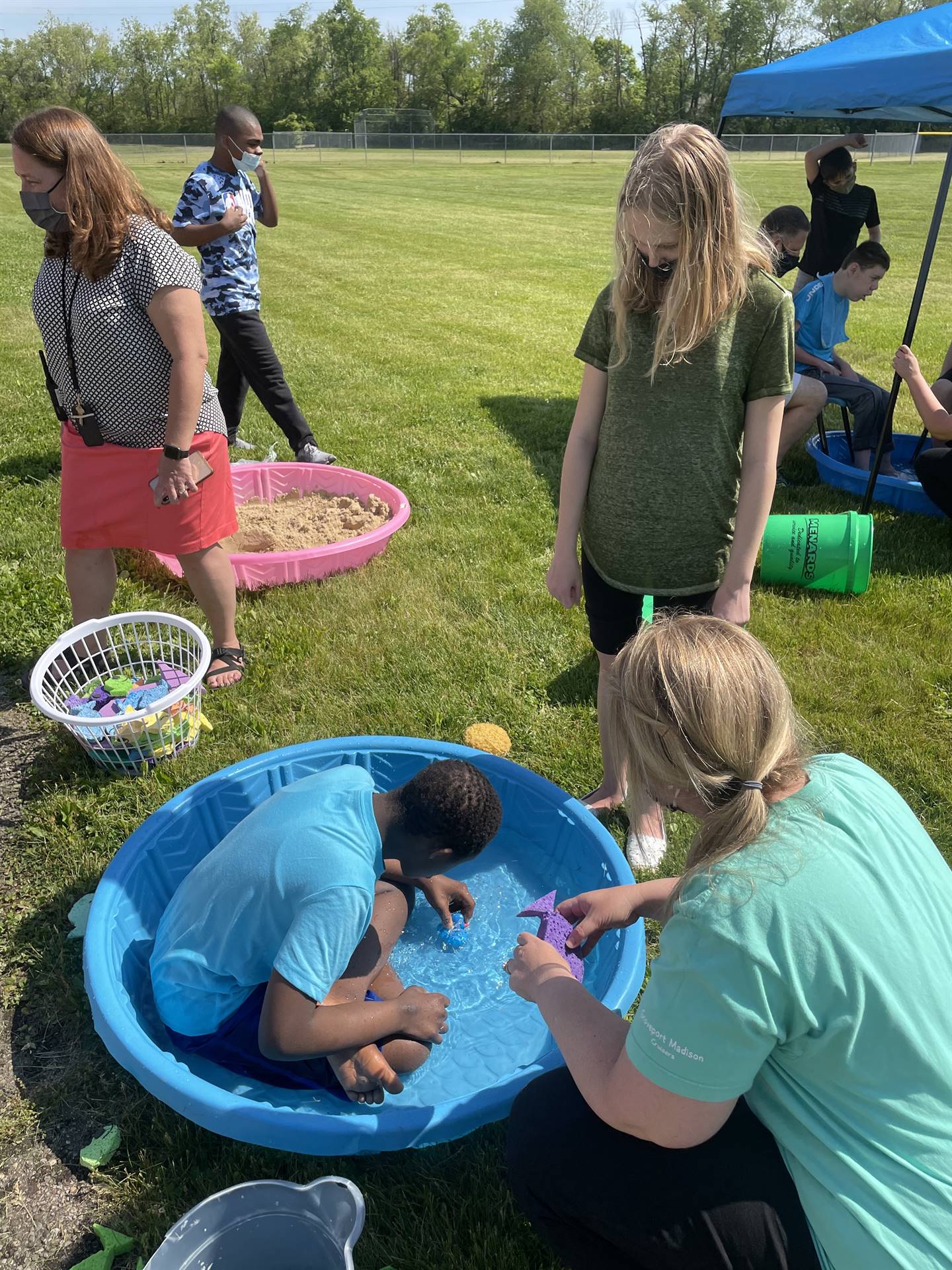 child plays in pool