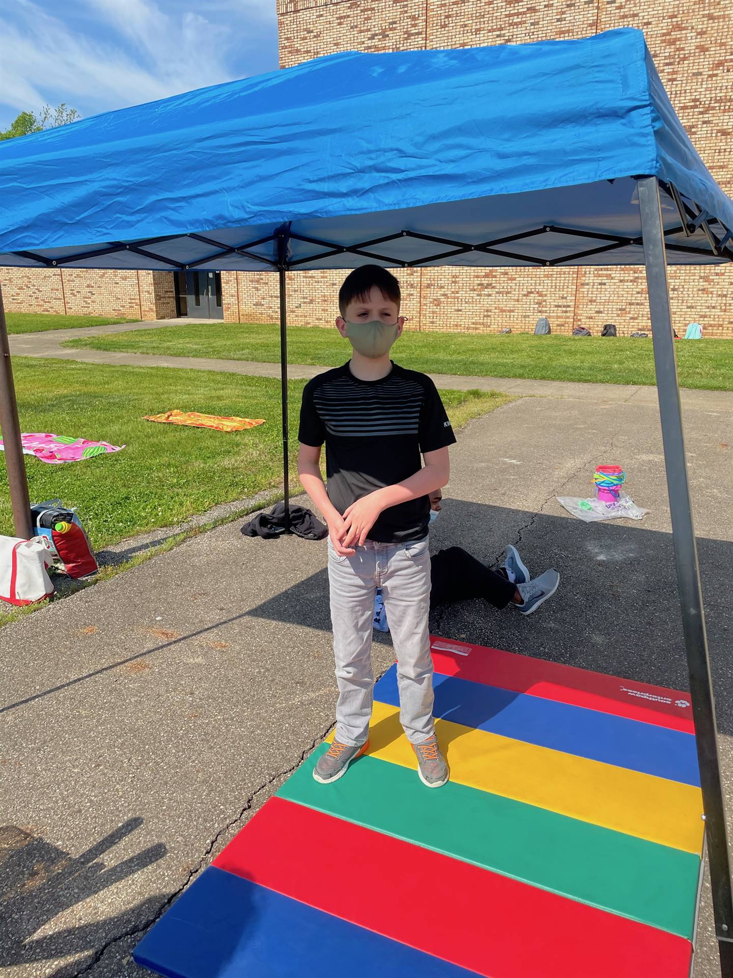 student under a tent