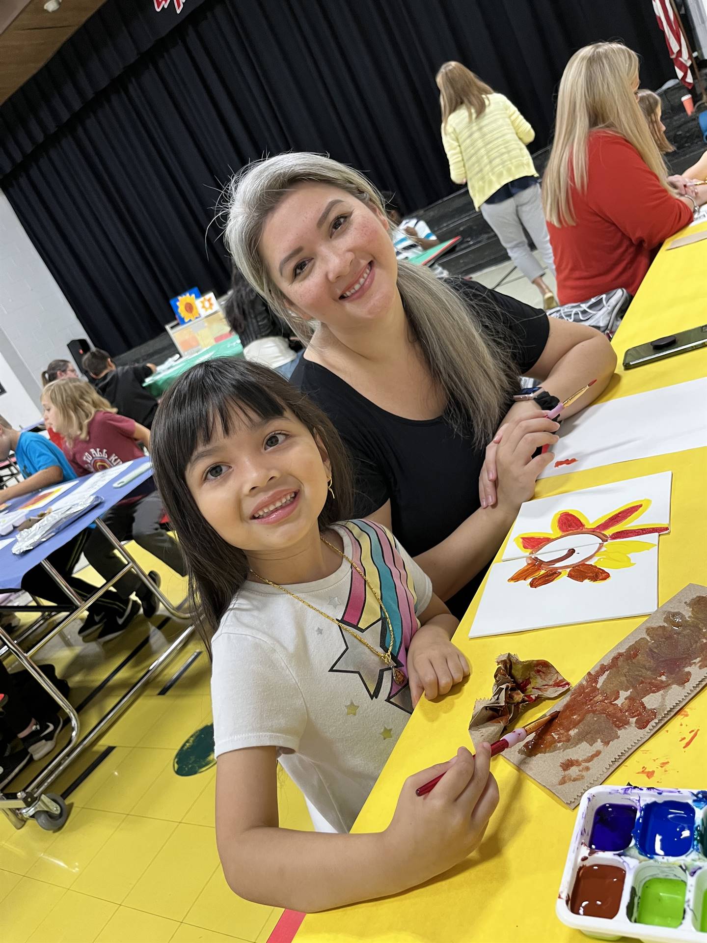 Parent and child showing painting