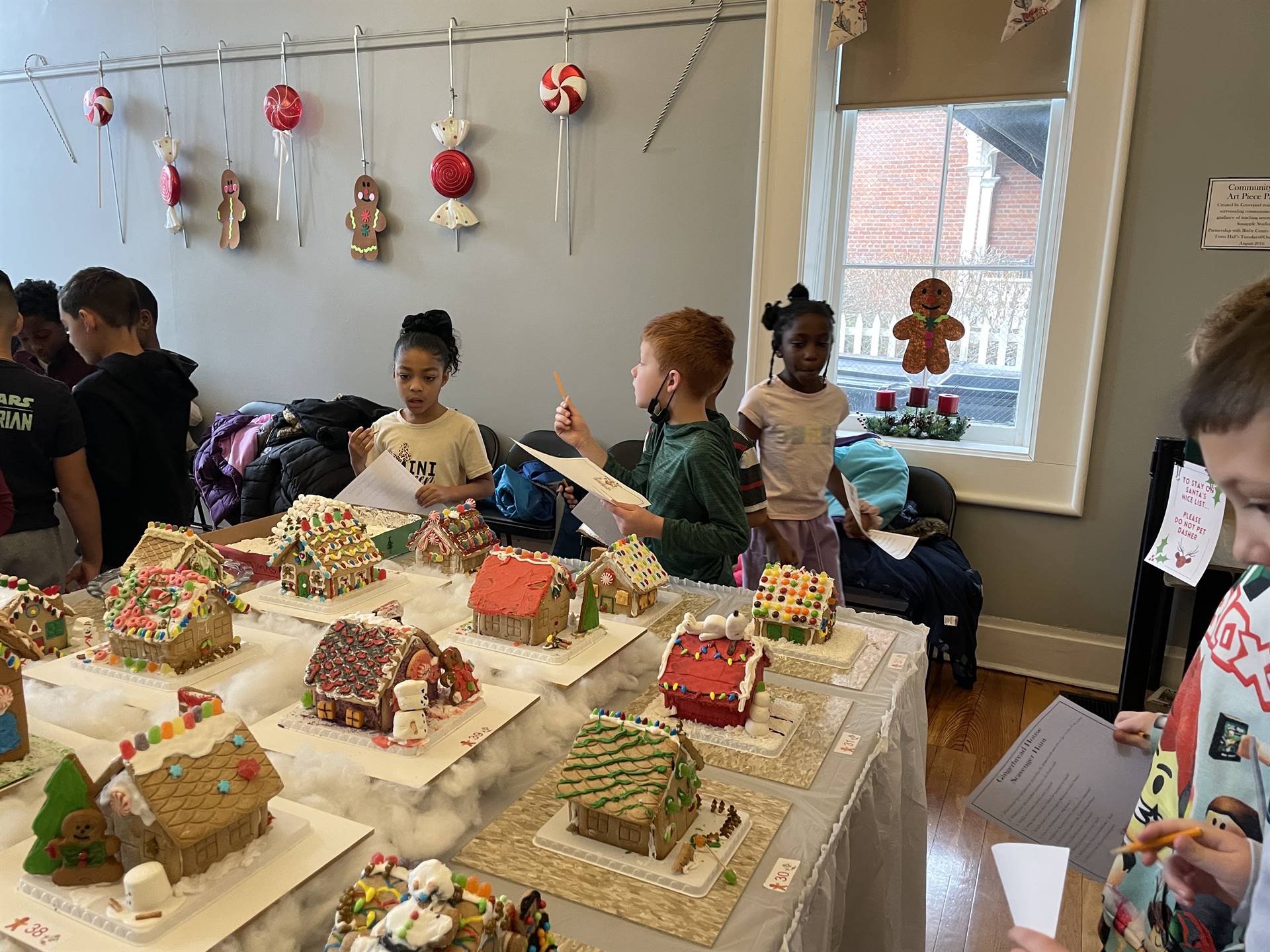 Students visiting the Town Hall Gingerbread display 