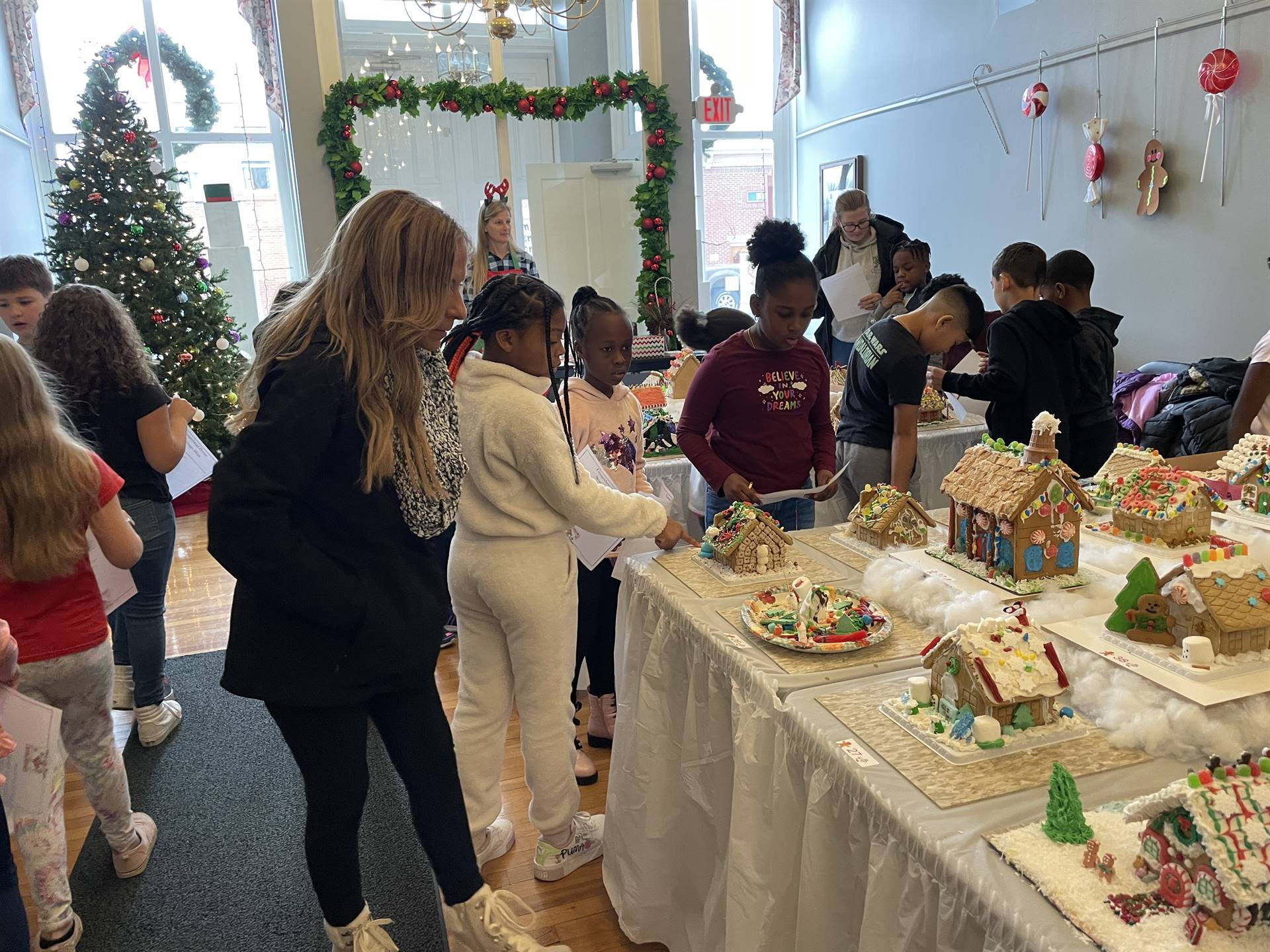 Students visiting the Town Hall Gingerbread display 