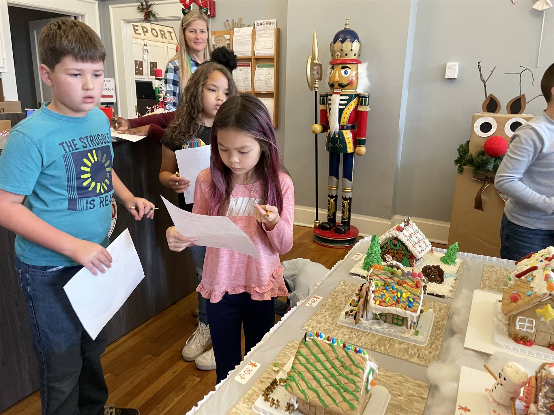 Students visiting the Town Hall Gingerbread display 