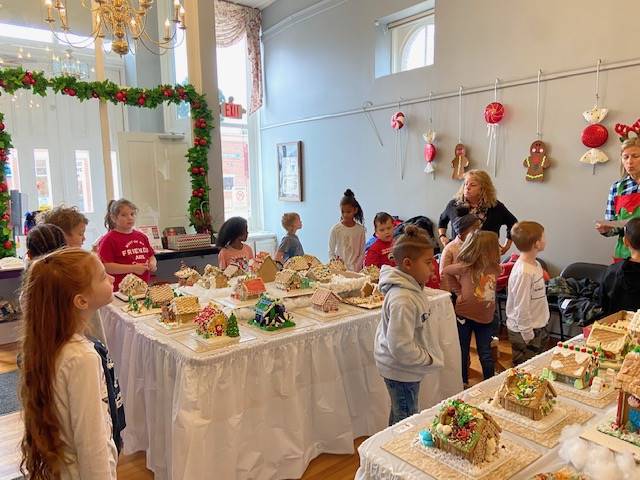 Students visiting the Town Hall Gingerbread display 