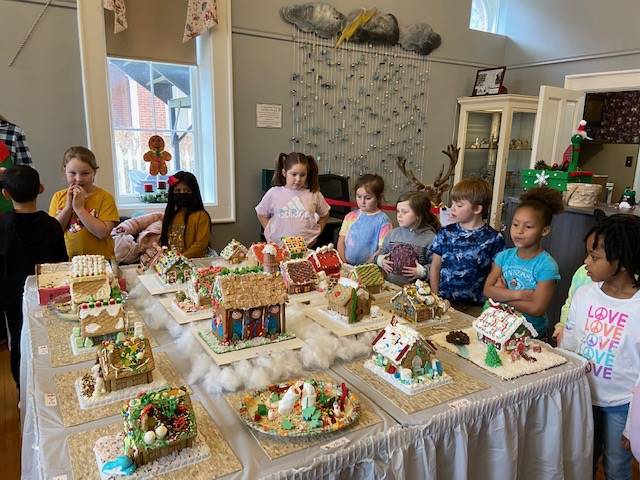 Students visiting the Town Hall Gingerbread display 