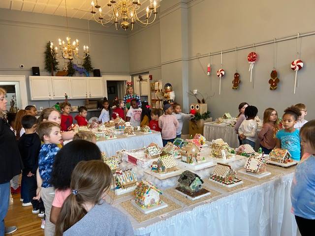 Students visiting the Town Hall Gingerbread display 