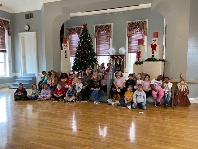 Students visiting the Town Hall Gingerbread display 