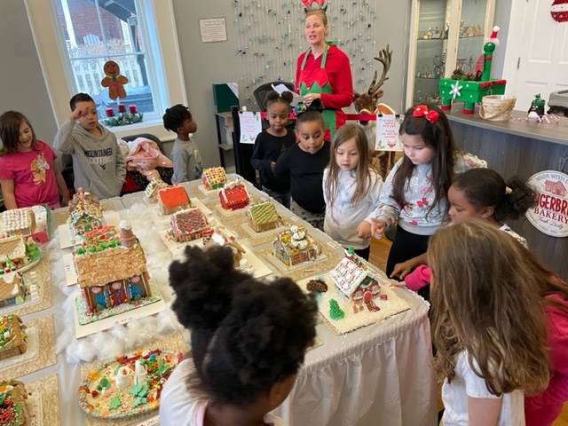 Students visiting the Town Hall Gingerbread display 