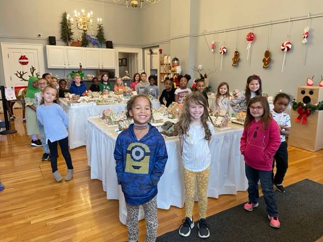 Students visiting the Town Hall Gingerbread display 