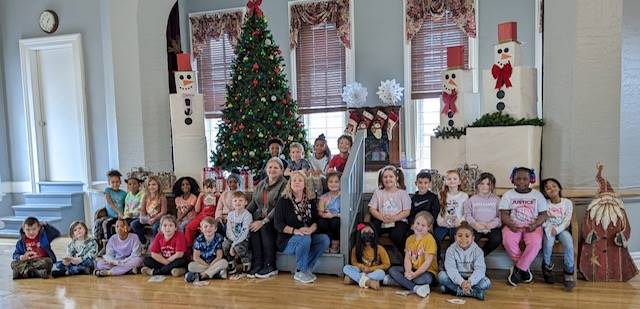 Students visiting the Town Hall Gingerbread display 