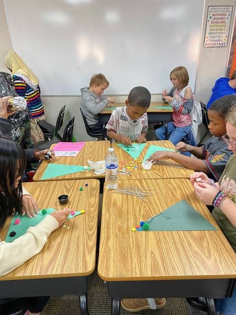 Students working on holiday craft