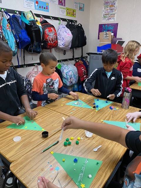 Students working on holiday craft