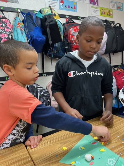 Students working on holiday craft