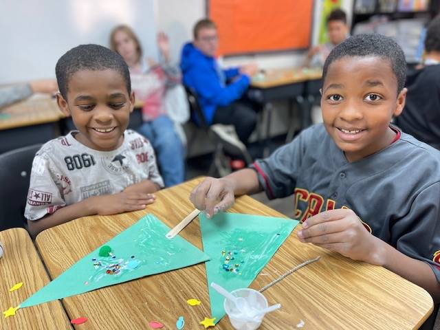 Students working on holiday craft