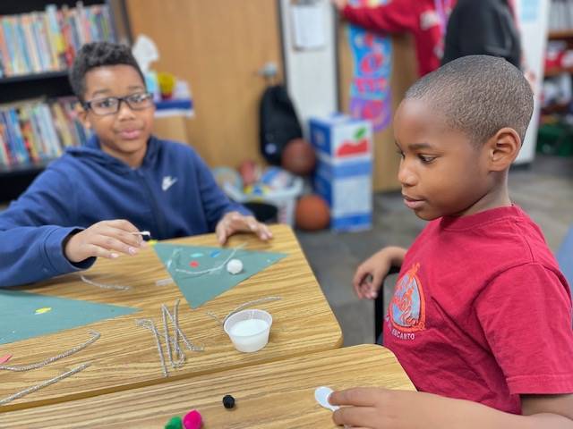 Students working on holiday craft