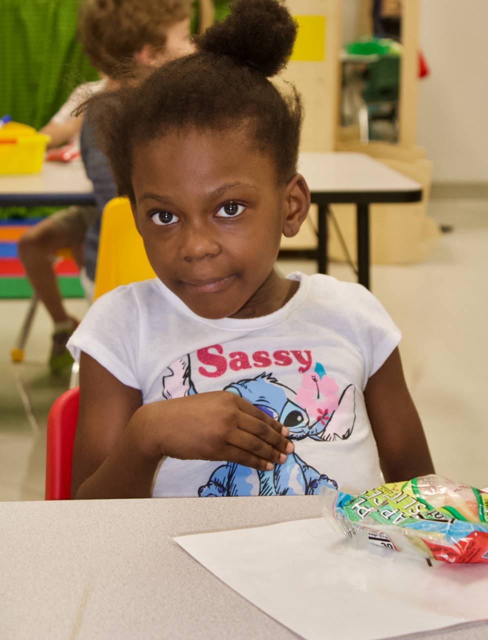 preschool girl eating snack