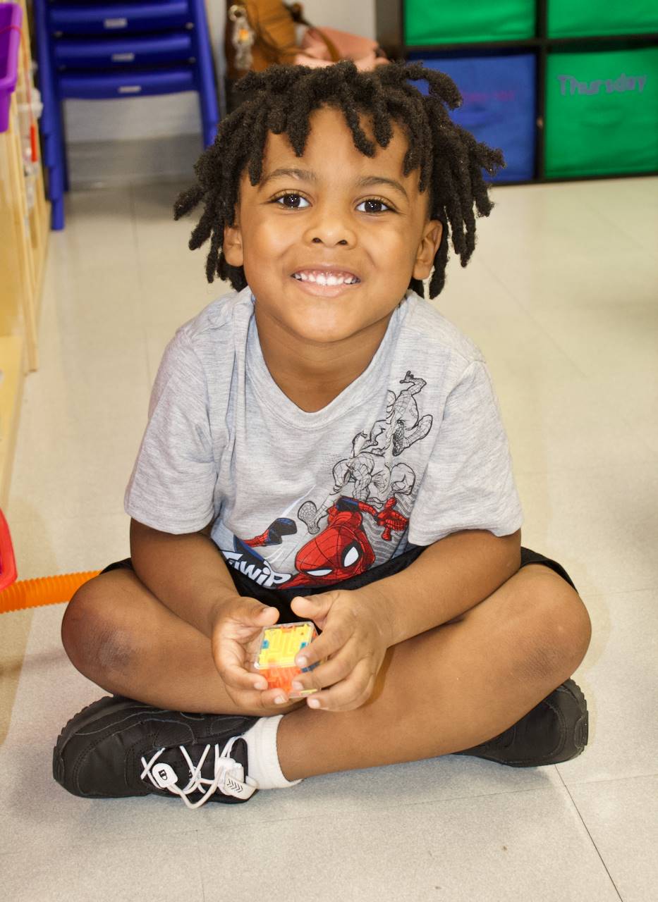 preschool boy in class