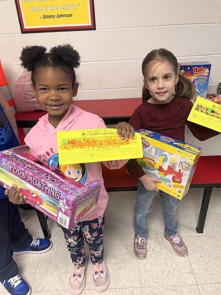 girls holding prizes