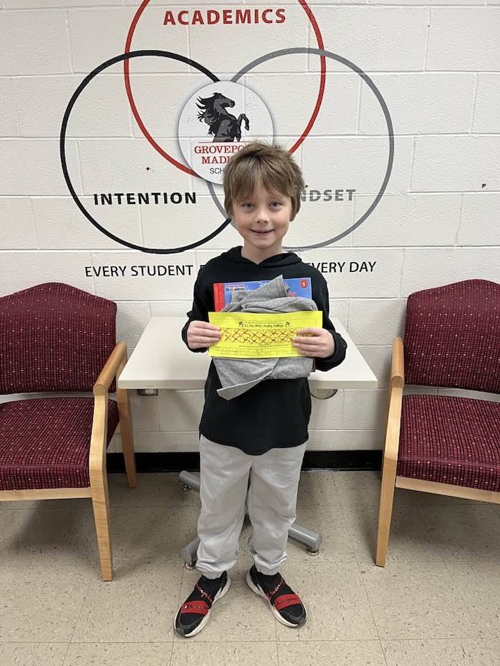 boy holding prize