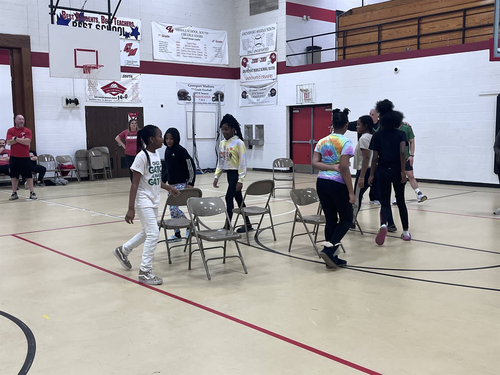 students playing musical chairs