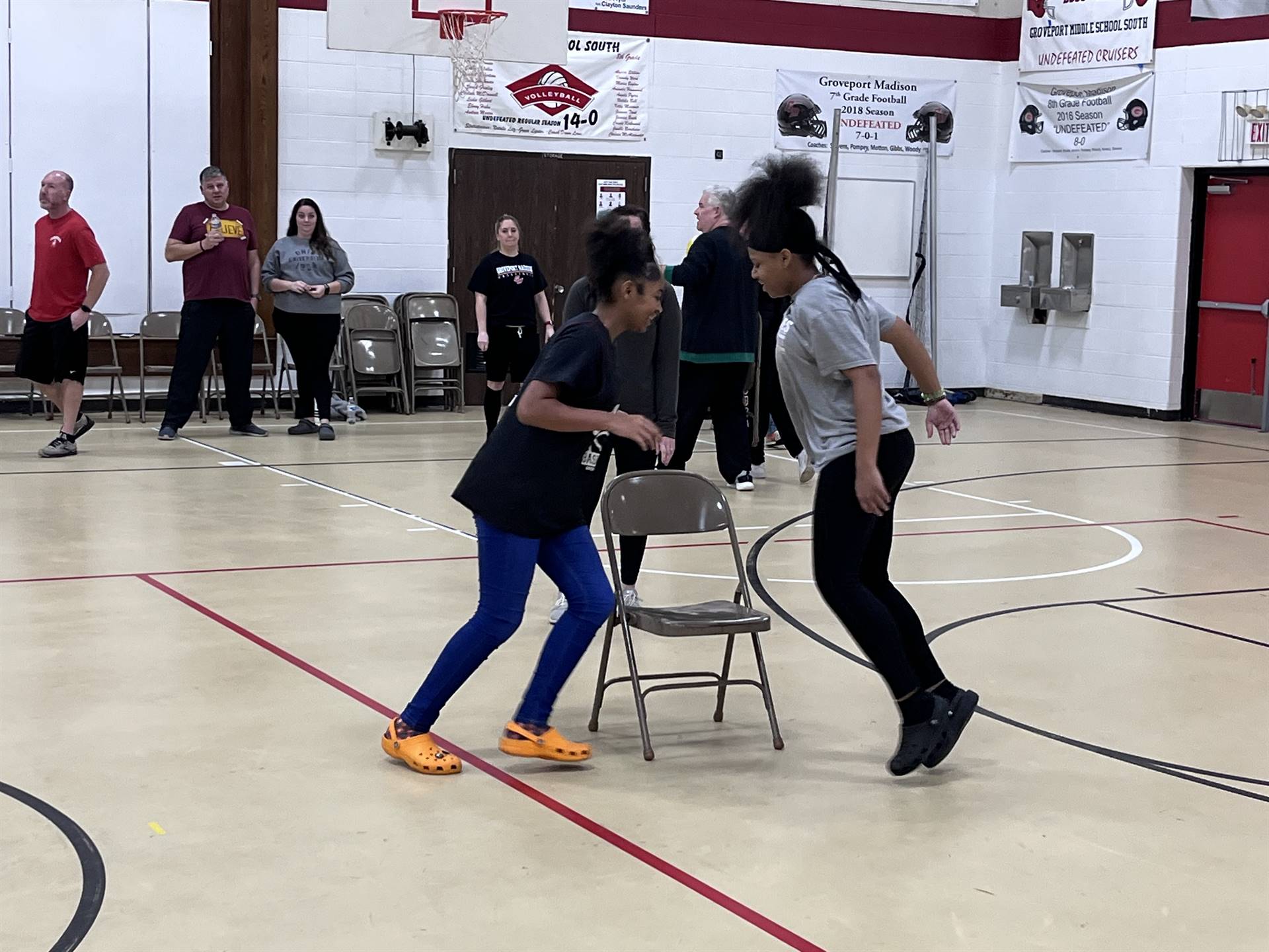 students playing musical chairs