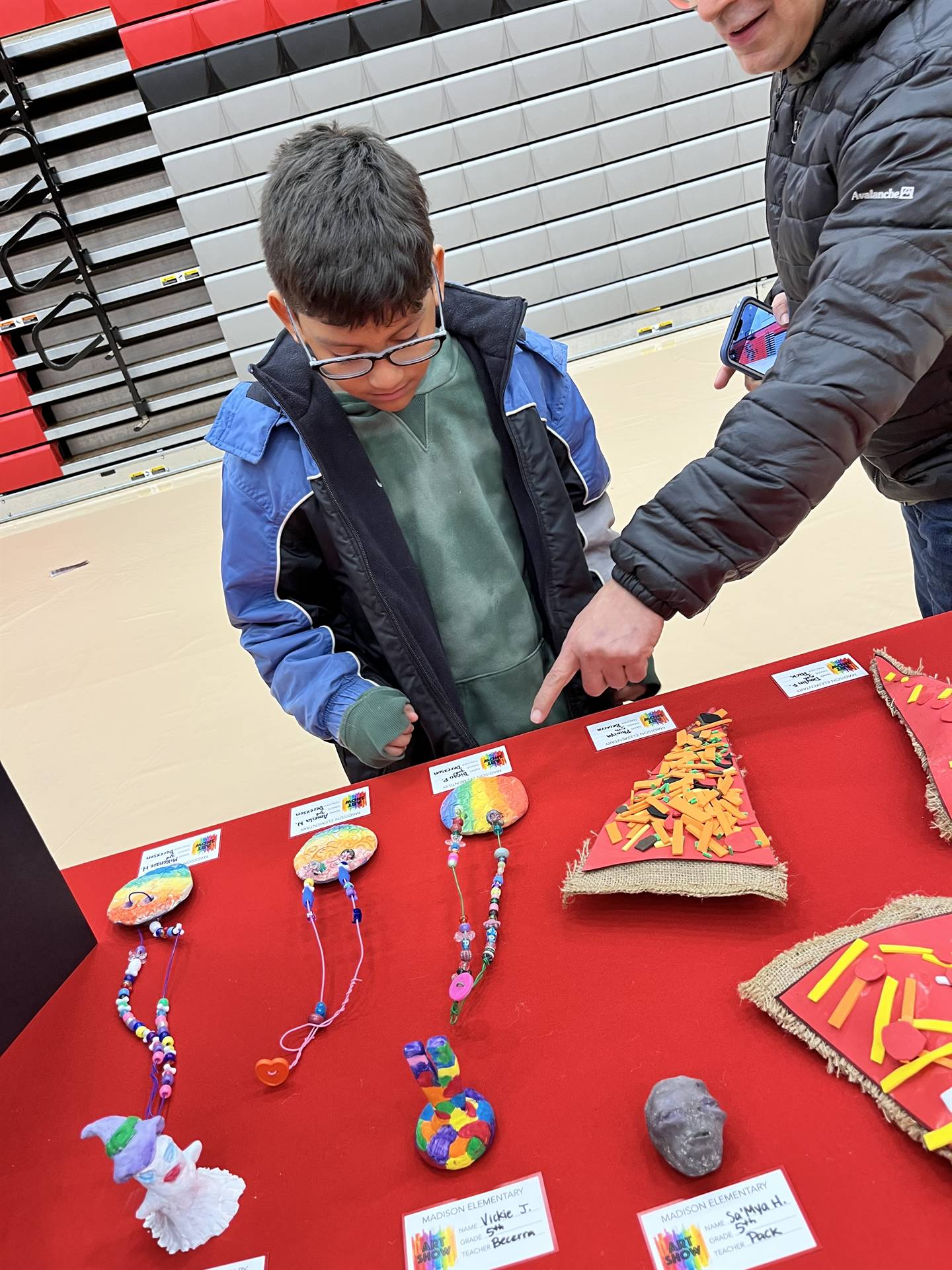 Students showing their artwork