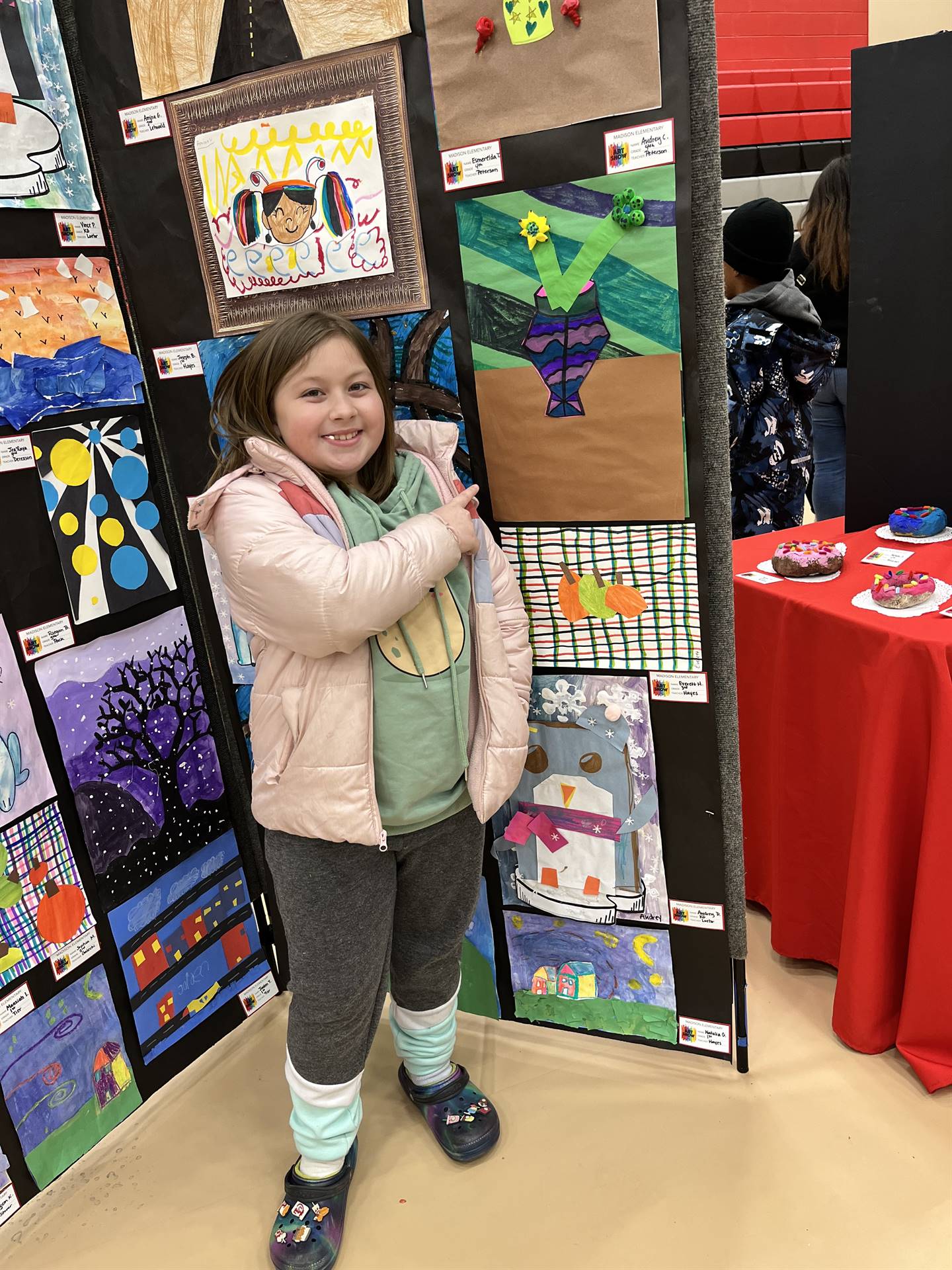 Students showing their artwork