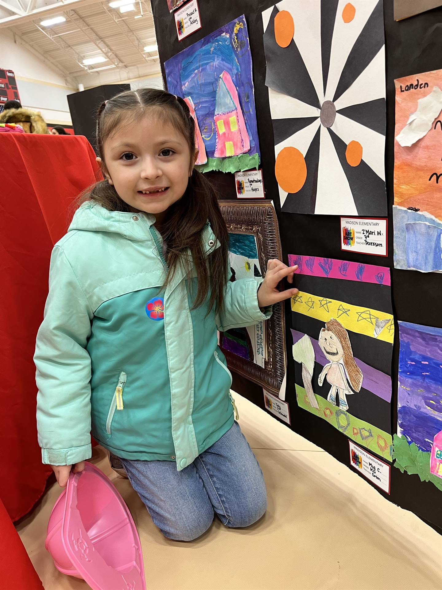 Students showing their artwork