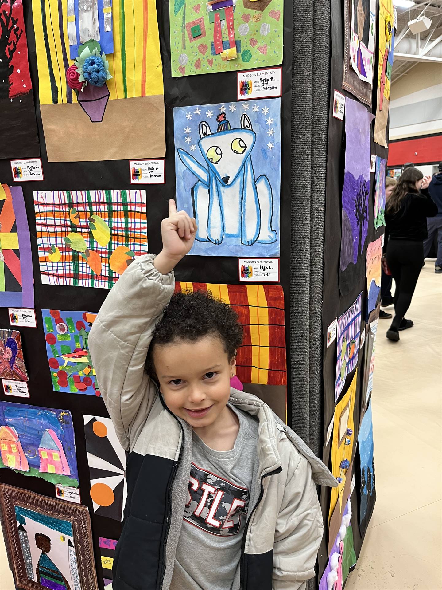 Students showing their artwork