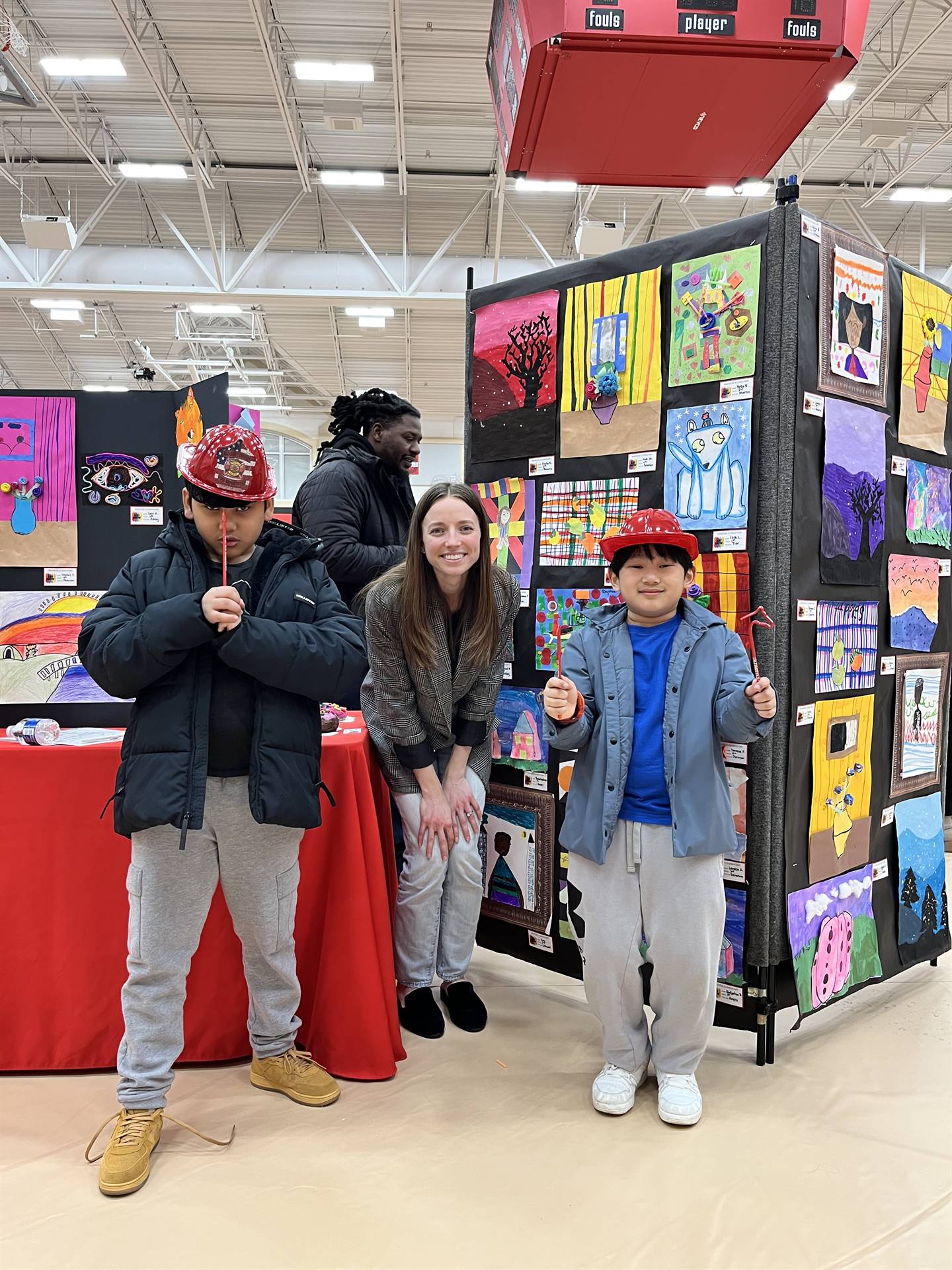 Students showing their artwork