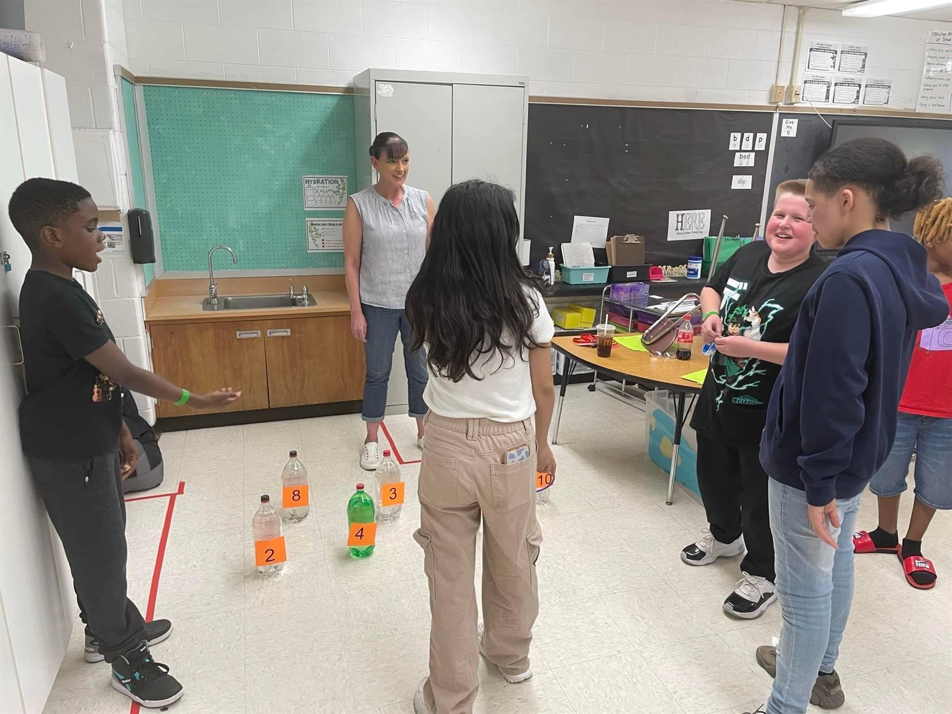Teacher and students playing a game