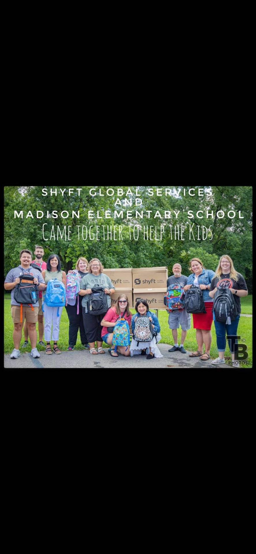 Madison Staff holding new backpacks